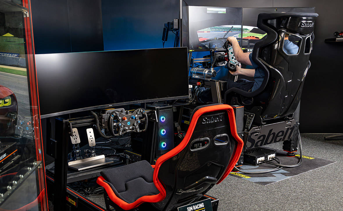 Our sim racing rig set up in the corner of our motorsports showroom in Wrexham, Wales available for sim racing session bookings Our sim racing rig set up in the corner of our motorsports showroom in Wrexham, Wales available for sim racing session bookings